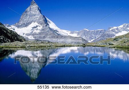 Reflection of mountain in lake, Mt Matterhorn, Riffelsee Lake, Zermatt, Valais Canton, Switzerland View Large Photo Image Stock Photography - Reflection of mountain in lake, Mt Matterhorn, Riffelsee Lake, Zermatt, Valais Canton, Switzerland . Fotosearch