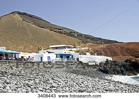 Stock Image - Restaurant at the coast of El Golfo, Lanzarote, Spain . Fotosearch