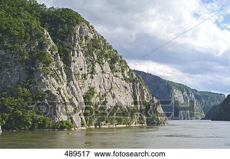 Stock Photo - River flowing through mountains, Danube River, Serbia . Fotosearch