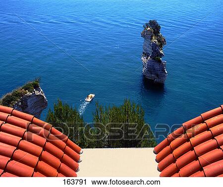 Rock formations in sea, Baia Delle Zagare, Parco Nazionale Del Gargano, Puglia, Italy View Large Photo Image Stock Image - Rock formations in sea, Baia Delle Zagare, Parco Nazionale Del Gargano, Puglia, Italy . Fotosearch