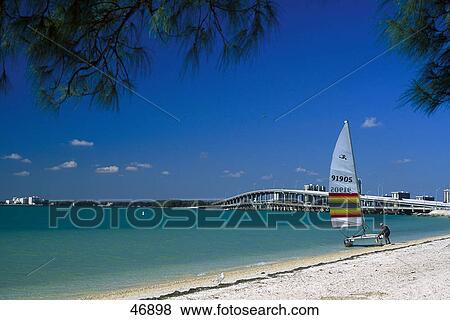 Stock Photo - Sailboat on beach, Rickenbacker Causeway, Biscayne Bay, Key Biscayne, Miami-Dade County, Florida, USA . Fotosearch