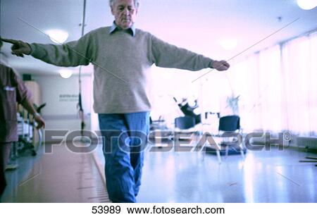 Senior man exercising in rehabilitation centre View Large Photo Image Stock Photo - Senior man exercising in rehabilitation centre . Fotosearch