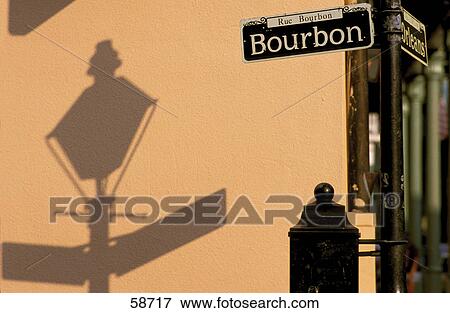Shadow of lantern on wall behind road sign View Large Photo Image Stock Photo - Shadow of lantern on wall behind road sign . Fotosearch