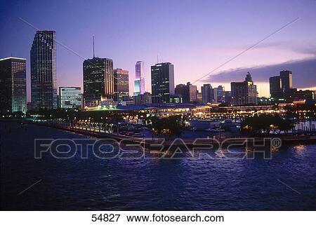 Shopping center and city skyline at dusk, Bayside Shopping Center, Miami, Florida, USA View Large Photo Image Stock Photo - Shopping center and city skyline at dusk, Bayside Shopping Center, Miami, Florida, USA . Fotosearch