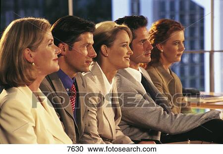 Side profile of group of business executives in a meeting View Large Photo Image Stock Image - Side profile of group of business executives in a meeting . Fotosearch