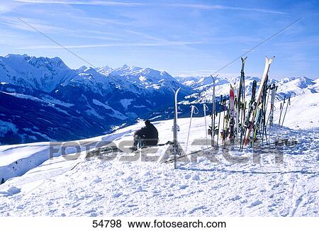 Skier resting ion snow covered hill, Koenigsleiten, Austria View Large Photo Image Stock Photo - Skier resting ion snow covered hill, Koenigsleiten, Austria . Fotosearch