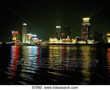 Stock Image - Skyscrapers illuminated at night, Pudong, Shanghai, China, Asia . Fotosearch