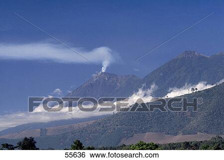 Stock Photograph - Smoke emitting from volcanic mountain, Fuego Volcano, Antigua Guatemala, Guatemala . Fotosearch
