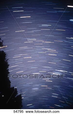 Star trails in sky View Large Photo Image Stock Photography - Star trails in sky . Fotosearch