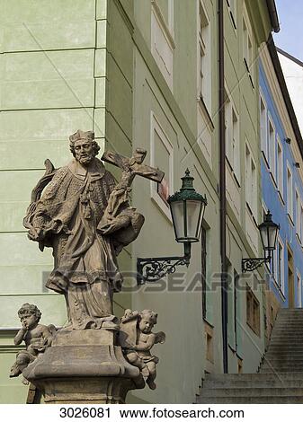 Stock Image - Statue in front of the corner of a house, Prague, Czech Republic . Fotosearch