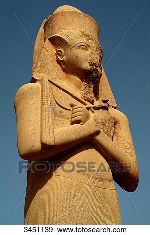 Stock Photo - Statue of a pharao, Karnak Temple, Karnak, Egypt, low angle view . Fotosearch