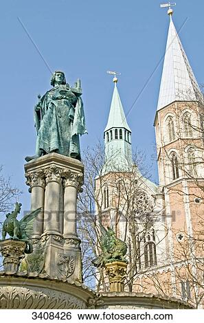 Statue of Henry the Lion, church in the background, Brunswick, Germany, low angle view View Large Photo Image Stock Photograph - Statue of Henry the Lion, church in the background, Brunswick, Germany, low angle view . Fotosearch