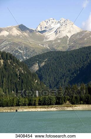 Sufnersee, forest and mountains in the background, Sufers, Switzerland View Large Photo Image Picture - Sufnersee, forest and mountains in the background, Sufers, Switzerland . Fotosearch