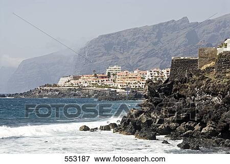 Tourist resorts on coast, Los Gigantes, Puerto De Santiago, Tenerife, Canary Islands, Spain View Large Photo Image Stock Photo - Tourist resorts on coast, Los Gigantes, Puerto De Santiago, Tenerife, Canary Islands, Spain . Fotosearch