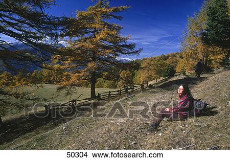 Tourist resting in valley, Eschtal valley, Alto Adige, Italy View Large Photo Image Picture - Tourist resting in valley, Eschtal valley, Alto Adige, Italy . Fotosearch