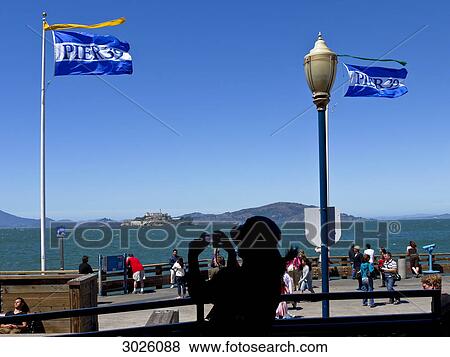 Tourist taking picture at Pier 39, San Francisco, USA View Large Photo Image Stock Photo - Tourist taking picture at Pier 39, San Francisco, USA . Fotosearch