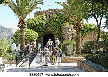 Tourists at the entrance of a chapel, Mijas, Spain View Large Photo Image Stock Photo - Tourists at the entrance of a chapel, Mijas, Spain . Fotosearch