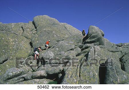 Stock Image - Tourists climbing mountain, Monte Limbara, Gallura, Sardinia, Italy . Fotosearch