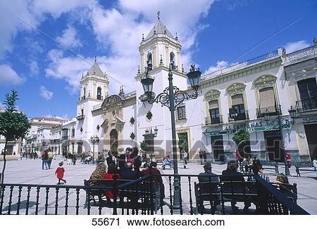 Stock Image - Tourists in city, Plaza Mayor, Ronda, Malaga, Andalusia, Spain . Fotosearch