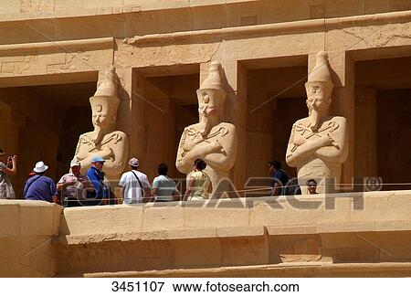 Tourists in front of statues at the Hatschepsut Temple, Luxor, Egypt, low angle view View Large Photo Image Stock Photo - Tourists in front of statues at the Hatschepsut Temple, Luxor, Egypt, low angle view . Fotosearch