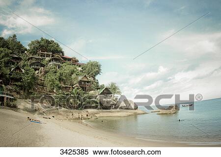 Stock Photography - Tourists on the beach of Ko Phangan, Thailand . Fotosearch