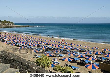 Tourists on the beach, Puerto del Carmen, Lanzarote, Spain, elevated view View Large Photo Image Stock Image - Tourists on the beach, Puerto del Carmen, Lanzarote, Spain, elevated view . Fotosearch