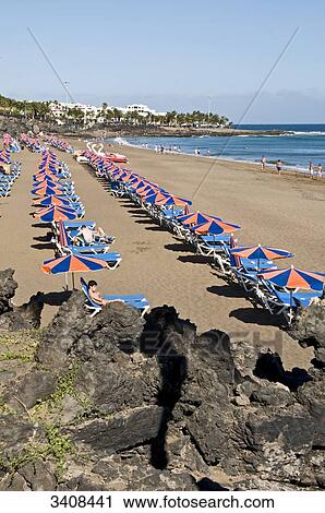 Tourists on the beach, Puerto del Carmen, Lanzarote, Spain, elevated view View Large Photo Image Stock Image - Tourists on the beach, Puerto del Carmen, Lanzarote, Spain, elevated view . Fotosearch