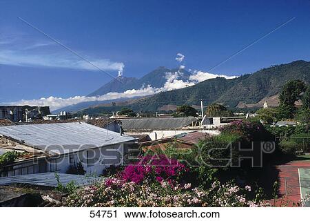 Town with active volcano in background, Fuego Volcano, Antigua Guatemala, Guatemala View Large Photo Image Stock Image - Town with active volcano in background, Fuego Volcano, Antigua Guatemala, Guatemala . Fotosearch