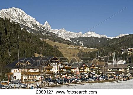 Town with mountain range in background, Dachstein Mountains, Filzmoos, St. Johann im Pongau, Salzburg, Austria View Large Photo Image Stock Photo - Town with mountain range in background, Dachstein Mountains, Filzmoos, St. Johann im Pongau, Salzburg, Austria . Fotosearch