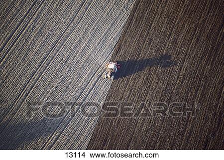 tractor on a field, Germany, aerial view View Large Photo Image Picture - tractor on a field, Germany, aerial view . Fotosearch