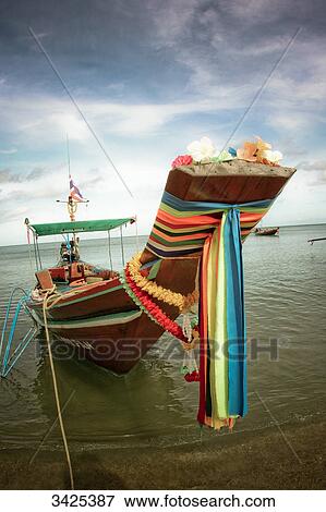 Traditional boat at the coast of Ko Phangan, Thailand View Large Photo Image Stock Photo - Traditional boat at the coast of Ko Phangan, Thailand . Fotosearch