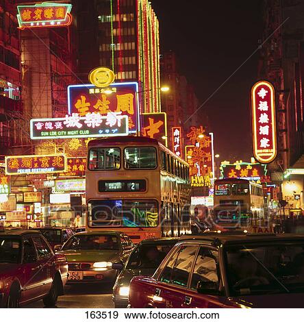 Stock Photo - Traffic on road in city lit up at night, Nathan Road, Kowloon, Tsim Sha Tsui, Hong Kong . Fotosearch