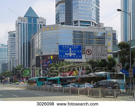 Traffic with modern buildings in the background, Shenzhen, China View Large Photo Image Stock Photo - Traffic with modern buildings in the background, Shenzhen, China . Fotosearch