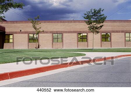 Trees in front of building View Large Photo Image Stock Image - Trees in front of building . Fotosearch