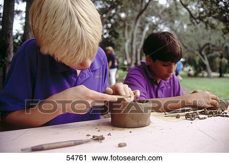 Two boys in art class, Miami, Florida, USA View Large Photo Image Stock Image - Two boys in art class, Miami, Florida, USA . Fotosearch
