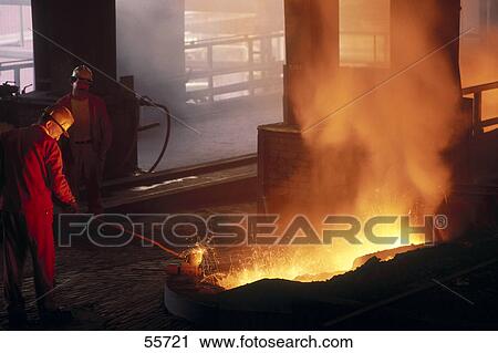 Two men working smelting plant, Aviles, Asturias, Spain View Large Photo Image Stock Image - Two men working smelting plant, Aviles, Asturias, Spain . Fotosearch