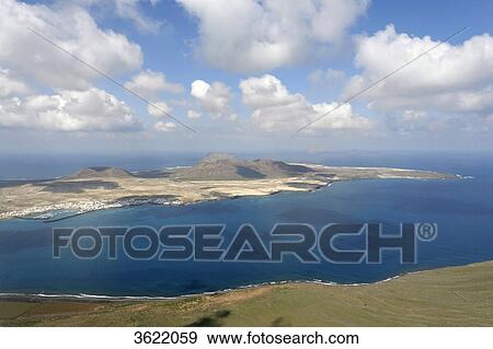 View from Mirador del Rio to Island La Graciosa and Caleta del Sebo, Lanzarote, Canary Islands, Spain, Europe View Large Photo Image Stock Photo - View from Mirador del Rio to Island La Graciosa and Caleta del Sebo, Lanzarote, Canary Islands, Spain, Europe . Fotosearch