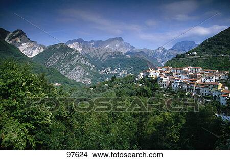 Village in a valley with mountains in the background, Versilia, Tuscany, Italy View Large Photo Image Picture - Village in a valley with mountains in the background, Versilia, Tuscany, Italy . Fotosearch