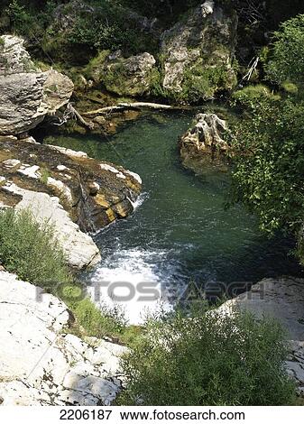 Stock Photo - Waterfall in river, Vis River, Navacelles, Languedoc-Roussillon, France . Fotosearch