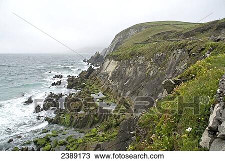 Waves breaking against rocks, County Kerry, Munster, Ireland View Large Photo Image Stock Image - Waves breaking against rocks, County Kerry, Munster, Ireland . Fotosearch