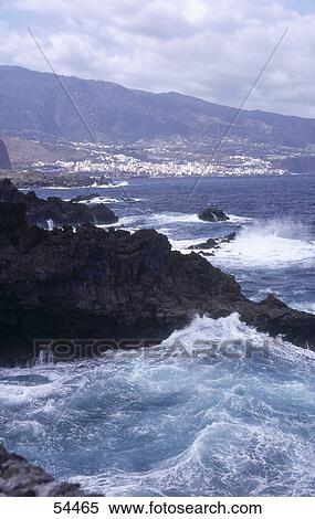 Waves crashing on a rocky coast, Santa Cruz La Palma, Canary Islands, Spain View Large Photo Image Stock Photography - Waves crashing on a rocky coast, Santa Cruz La Palma, Canary Islands, Spain . Fotosearch