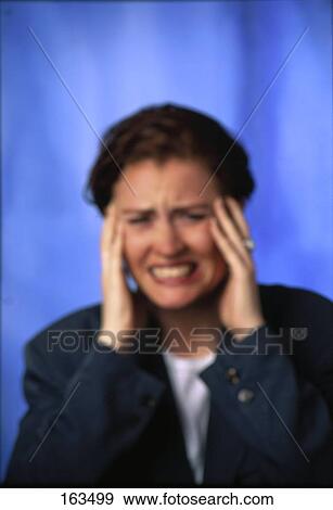 Stock Photo - Woman holding head . Fotosearch