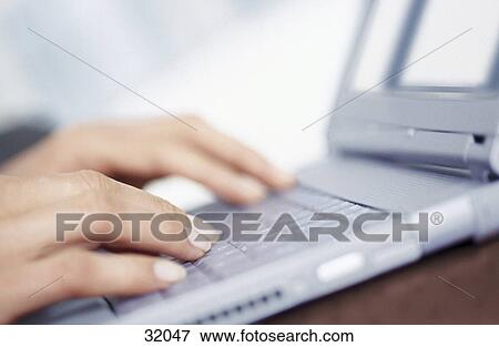 Stock Photo - Woman using a laptop . Fotosearch