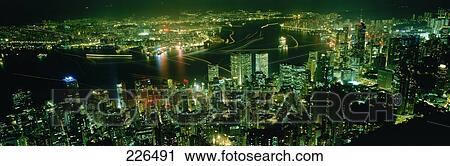 Aerial view of city lit up at night, China View Large Photo Image Stock Image - Aerial view of city lit up at night, China . Fotosearch