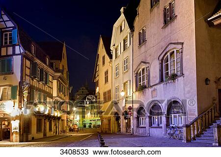 Stock Image - Alley in the old town of Colmar at night, France . Fotosearch