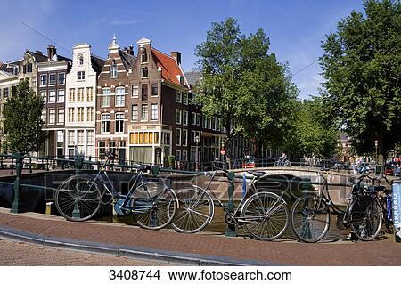 Bicycles on a bridge in Amsterdam, Netherlands View Large Photo Image Picture - Bicycles on a bridge in Amsterdam, Netherlands . Fotosearch