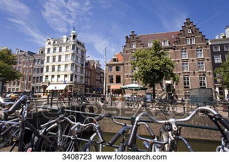 Bicycles on a bridge in Amsterdam, Netherlands View Large Photo Image Stock Image - Bicycles on a bridge in Amsterdam, Netherlands . Fotosearch