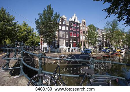 Bicycles on a bridge in Amsterdam, Netherlands View Large Photo Image Stock Photo - Bicycles on a bridge in Amsterdam, Netherlands . Fotosearch
