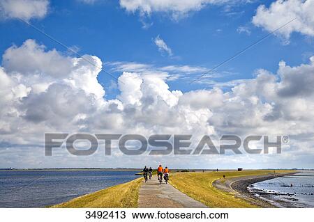 Biker on a dyke, Sylt, Germany, elevated view View Large Photo Image Stock Image - Biker on a dyke, Sylt, Germany, elevated view . Fotosearch