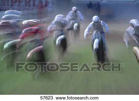 Blurred view of motocross racers in action View Large Photo Image Stock Image - Blurred view of motocross racers in action . Fotosearch